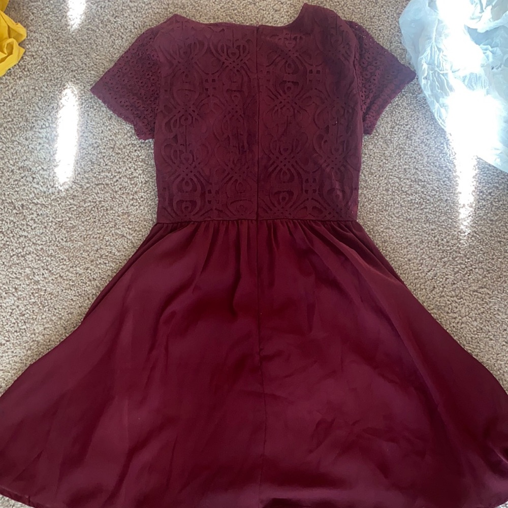 Maroon fit and flare dress with lace detailing on the top